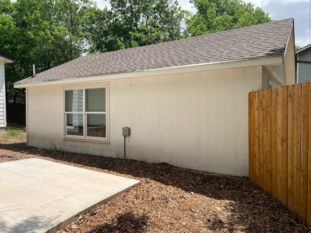 Side view of a garage converted into a backyard ADU at 500 Capitol Drive, Austin TX