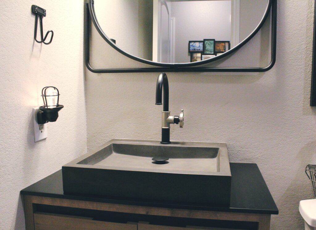 Modern bathroom remodel with stone vessel sink in Cedar Park TX