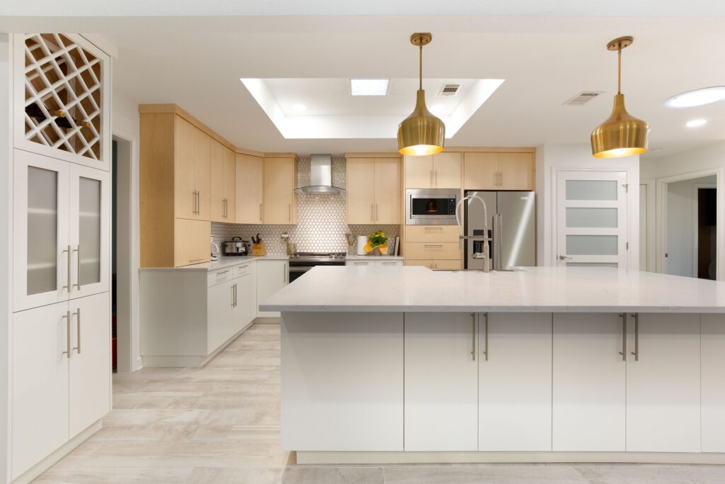 Kitchen remodel with large white island and pendant lights in Round Rock TX