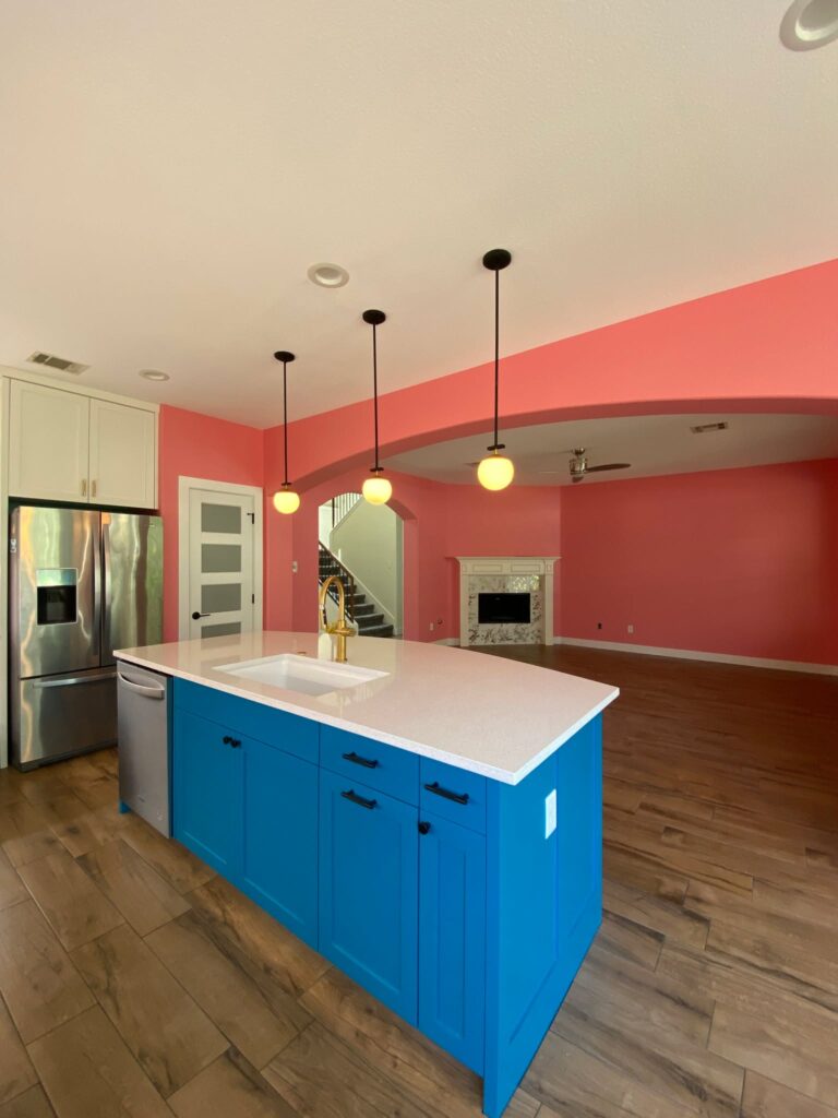 Open kitchen remodel with blue island in Round Rock TX