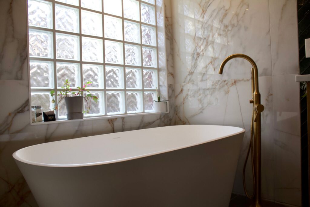 Bathroom remodel with freestanding tub and gold fixtures in Circle C, South Austin TX