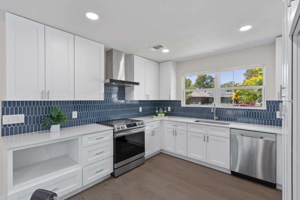 White kitchen remodel with blue tile backsplash in Austin TX